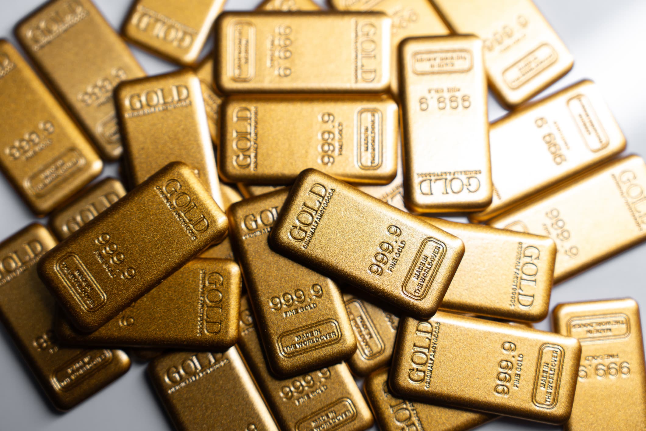 Gold slides as firm dollar, Fed hike expectations pressure bullion