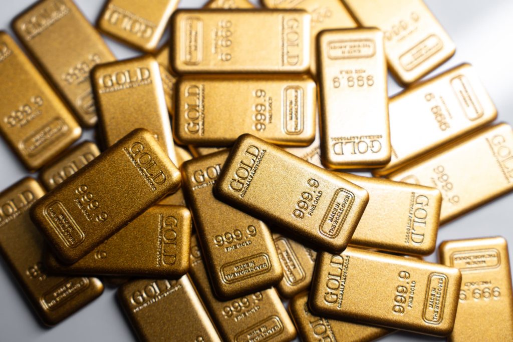 Gold nears two-week low as stronger dollar, Fed hike bets pressure prices